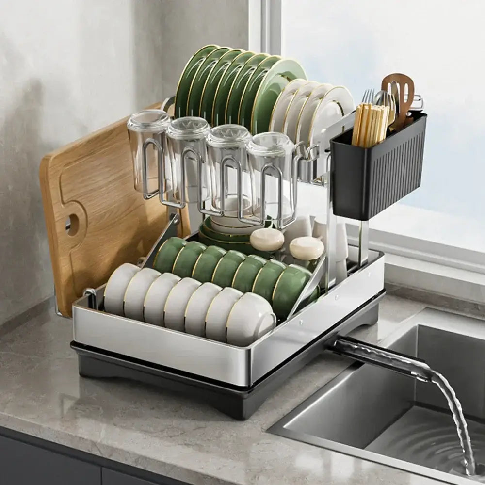 Modern black stainless steel 2 tier dish drainer rack with tiered compartments holding plates bowls glassware and utensils