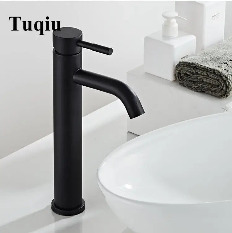 Modern black stainless steel basin faucet with a black matte finish and sleek cylindrical minimalist design by decorbites