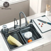 Modern black stainless steel double basin kitchen sink with integrated faucet and side sprayer for efficient use