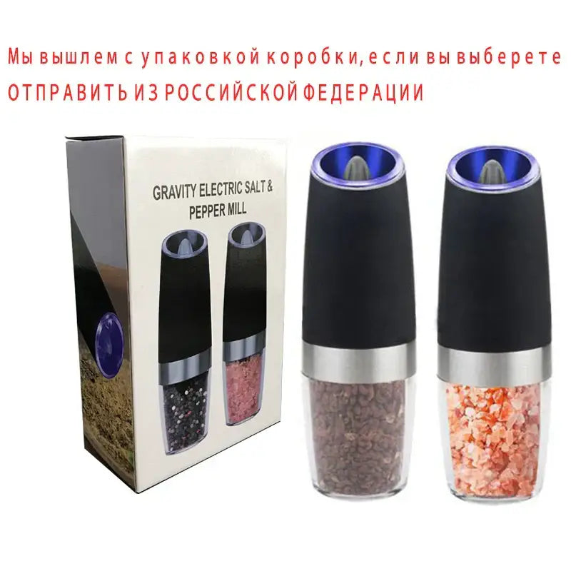 Modern black and stainless steel electric salt pepper grinder set with clear glass bodies and blue-lit tops filled with peppercorns and salt