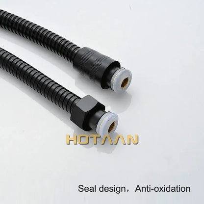 Modern black stainless steel flexible shower hose with black corrugated hose and metal fittings for bathroom use
