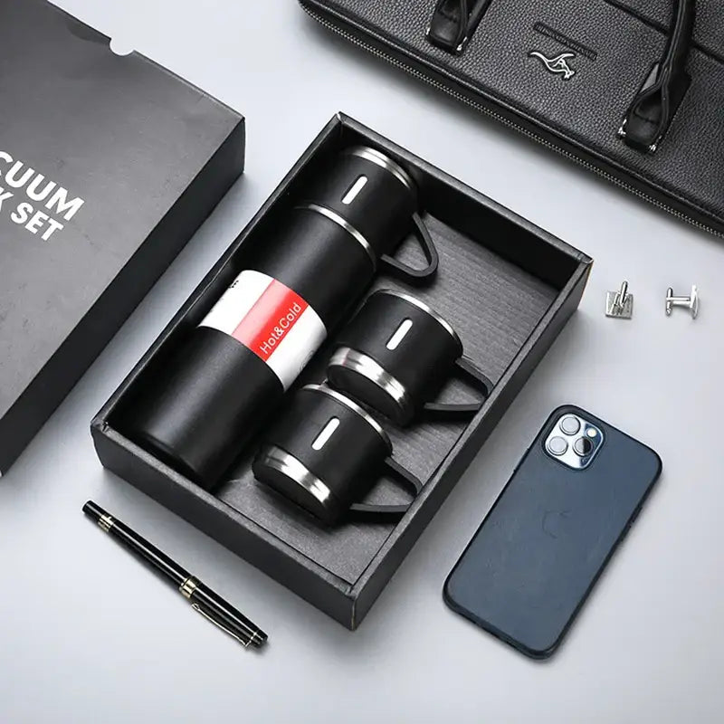 Modern black stainless steel insulated water bottle gift set with vacuum insulated water flask and matching mugs in box