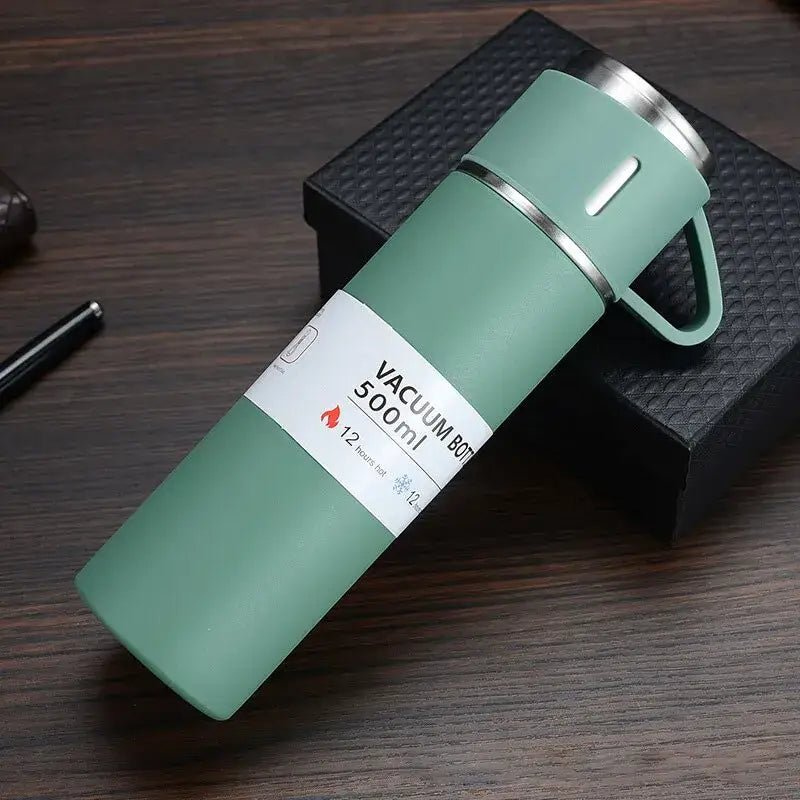 Matte mint green stainless steel vacuum insulated water bottle with 500ml capacity and stainless steel lid handle in modern black gift set