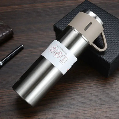 Modern black stainless steel insulated water bottle gift set with vacuum insulated water mug and beige lid and handle