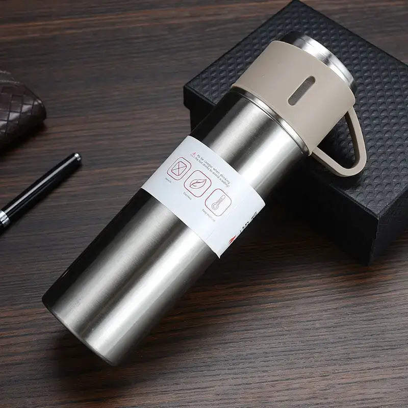Modern black stainless steel insulated water bottle gift set with vacuum insulated water mug and beige lid and handle