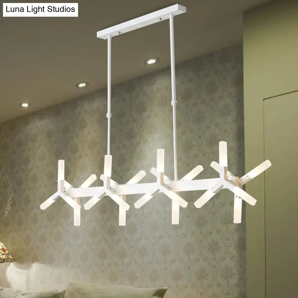 Modern white pendant light with geometric starburst design made of sleek metal with linear acrylic shade ideal over island
