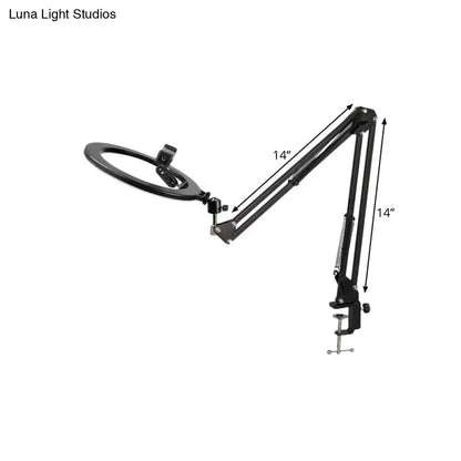 Black adjustable LED ring light with 14-inch swing arm and clamp base for modern bedroom mirror light use
