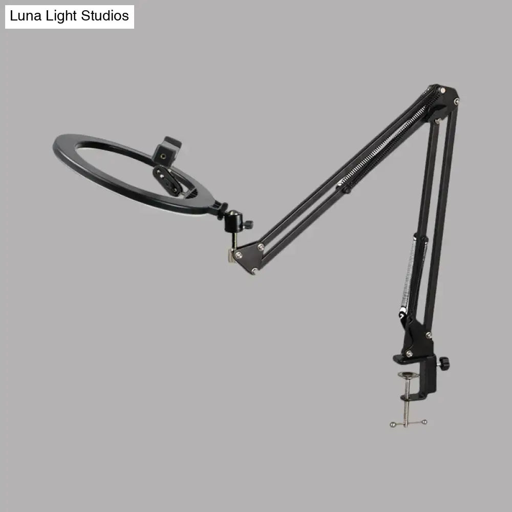 Black adjustable led ring mirror light with swing arm, articulated arm, and clamp base for bedroom use