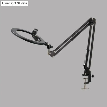 Black adjustable led ring mirror light with swing arm, articulated arm, and clamp base for bedroom use