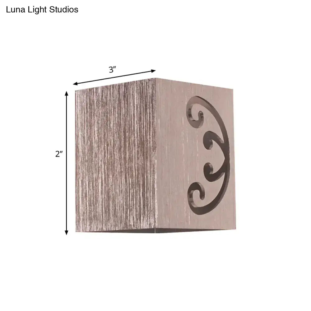 Modern black swirl led wall lamp featuring a square rustic wooden box with elegant scrollwork cutout for bedroom use