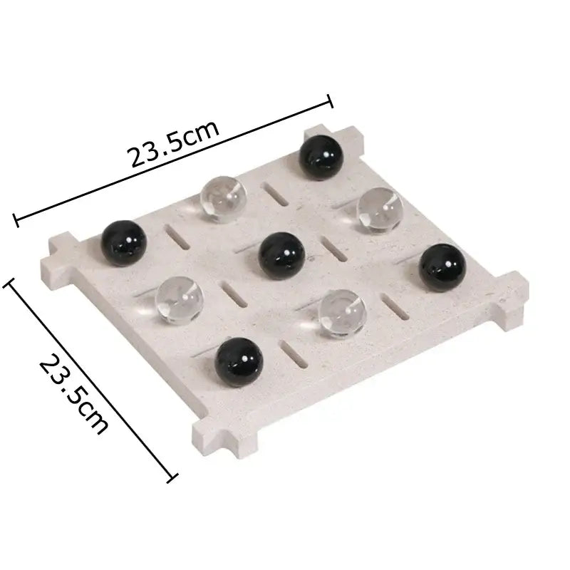Modern black and tan decorbites acrylic tic-tac-toe chessboard set with light gray stone grid and black clear marbles