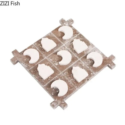 Rustic brown stone tic-tac-toe board with white ceramic moon and castle pieces in decorbites acrylic tic-tac-toe set