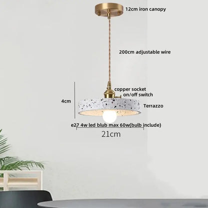 Modern black terrazzo led pendant lamp with circular terrazzo shade, brass canopy, and copper socket for dining room decorbites black terrazzo
