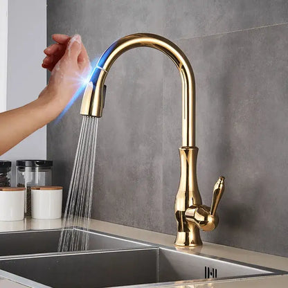 Gold-colored modern kitchen faucet with curved spout and pull-down spray head by decorbites black touch sensor