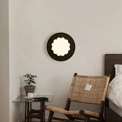 Modern black travertine wall lights featuring a circular scalloped frosted glass center for bedroom decorbites black travertine