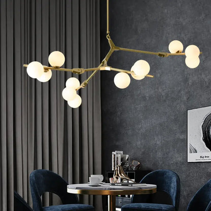 Gold-toned modern led ceiling light with frosted glass globes in a branching tree-like design for dining room use