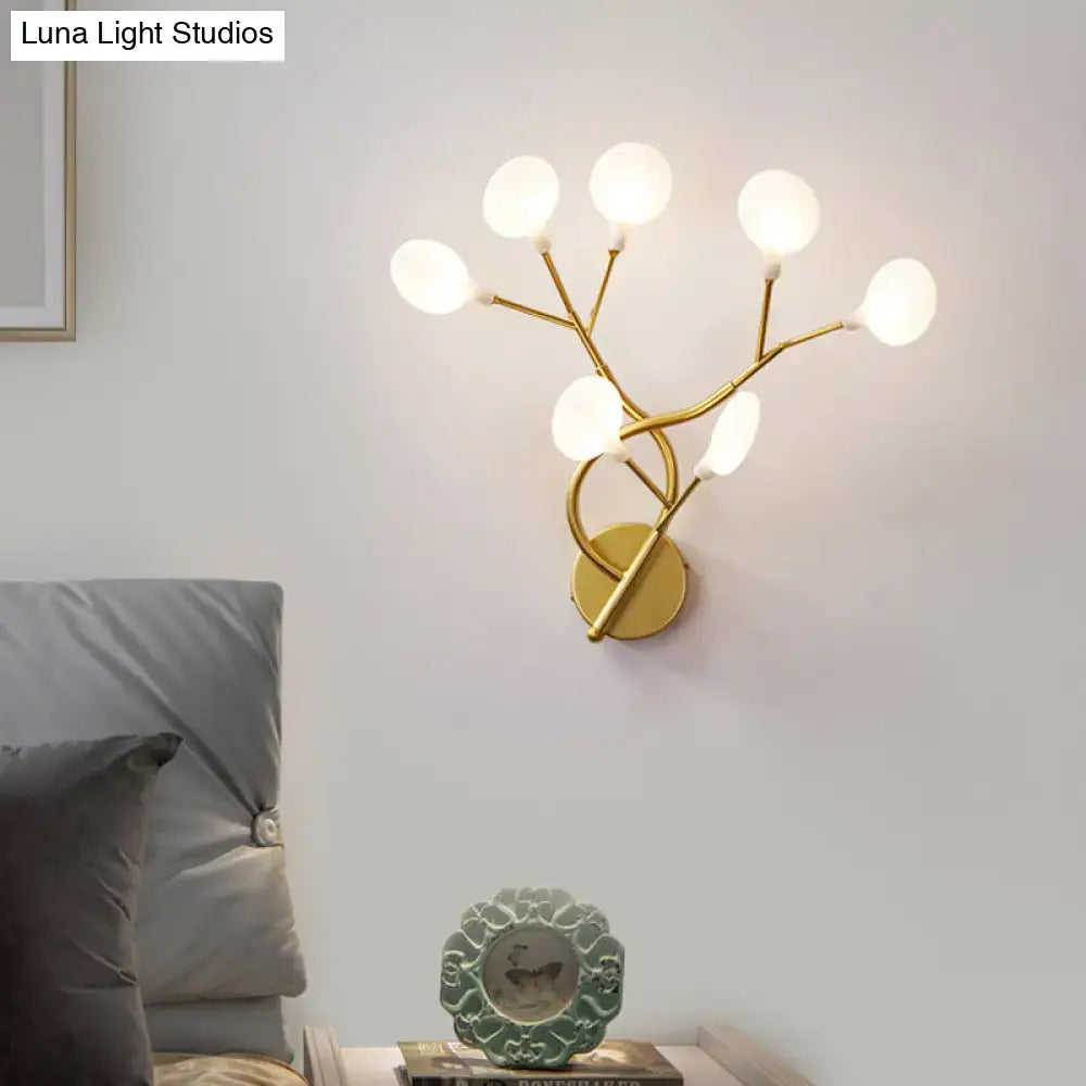 Modern black tree branch wall light with six frosted glass globes and gold-toned 24 inch fixture for bedroom
