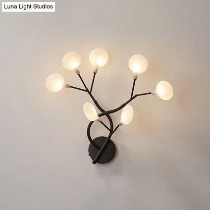 Modern black metal wall light with five frosted glass globe bulbs in a branching tree design 6 inch fixture