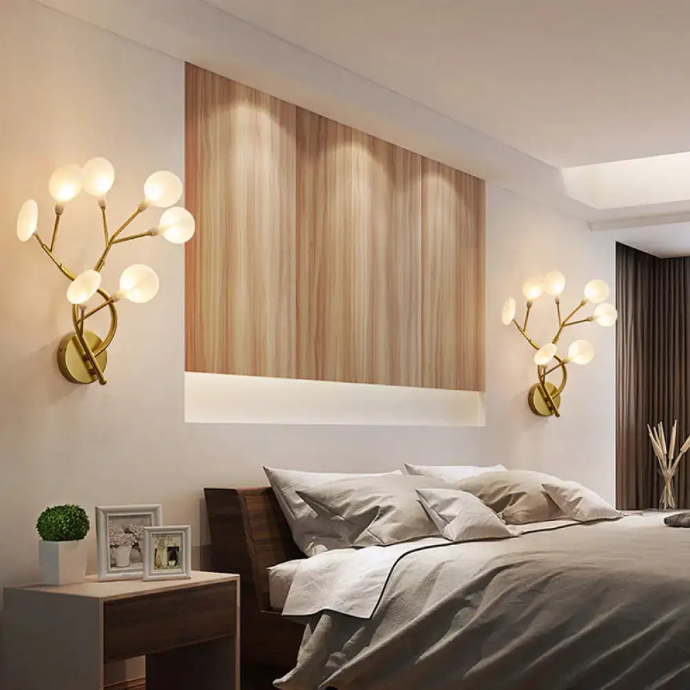 Gold-toned wall light with branching arms and six frosted glass globes modern inch fixture for bedroom use