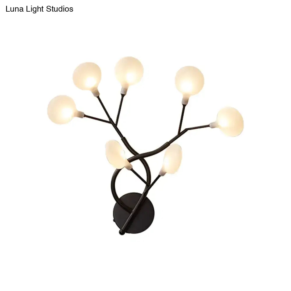 Modern black metal wall light with five frosted glass globes in a 6 inch tree branch fixture for bedroom use