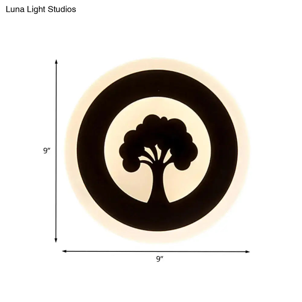 Modern black tree pattern led flush wall sconce with concentric rings emitting warm glow for bedroom lighting