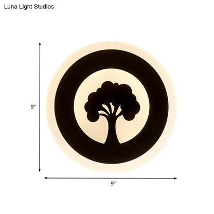 Modern black tree pattern led flush wall sconce with concentric rings emitting warm glow for bedroom lighting