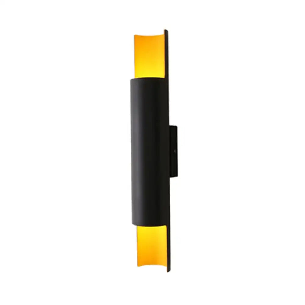 Modern black tubular wall mounted bedside lamp with warm amber glass panels compatible with e26 e27 bulbs