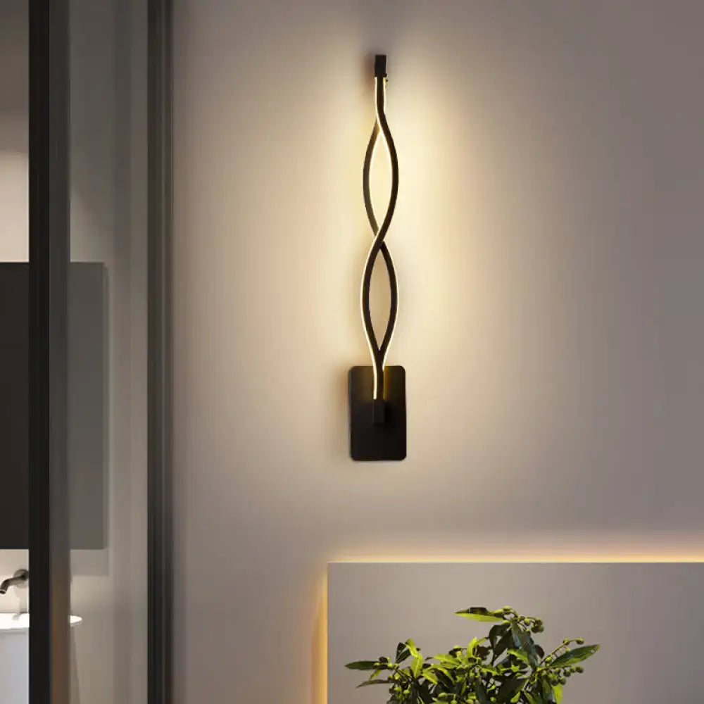 Modern black twisted led stairway sconce with sleek design and warm white light for bedroom lighting