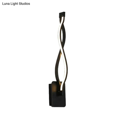 Modern black twisted led wall sconce with warm white light designed for stairway and bedroom lighting