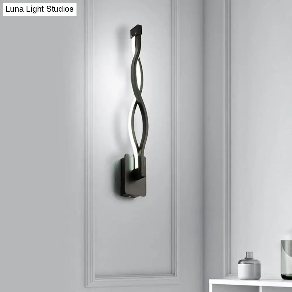 Modern black twisted led stairway sconce with warm white light and sleek minimalist design for bedroom lighting