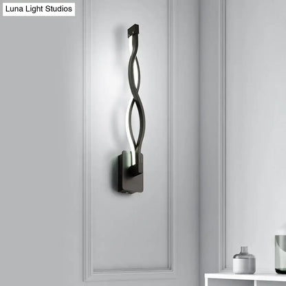 Modern black twisted led stairway sconce with warm white light and sleek minimalist design for bedroom lighting