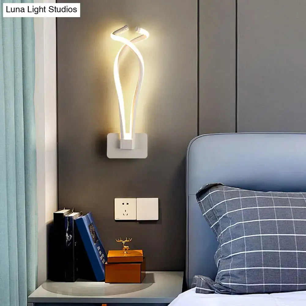 Modern white led wall sconce with sleek twisted design complements bedroom lighting with contemporary style