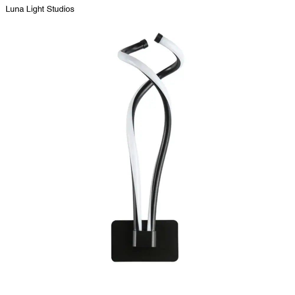 Modern black and white twisted led table lamp with sleek minimalist design for bedroom lighting use