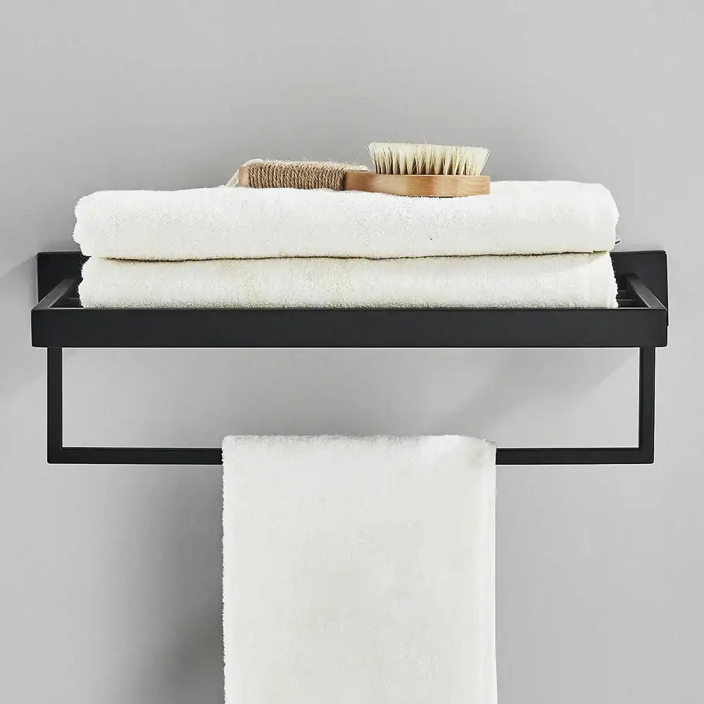 Modern black two tier towel rack with shelf and hanging bar holding white towels decorbites black towel rack