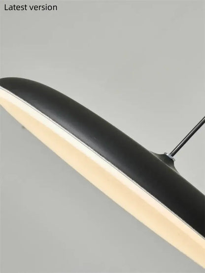 Modern black ufo pendant light with sleek curved design and warm led illumination as a modern design light source