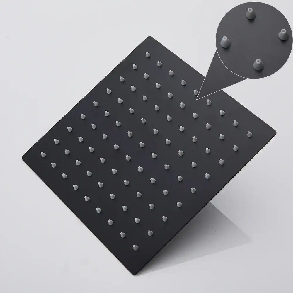 Black matte ultrathin square rainfall shower head with evenly spaced rounded nozzles for modern bathroom use