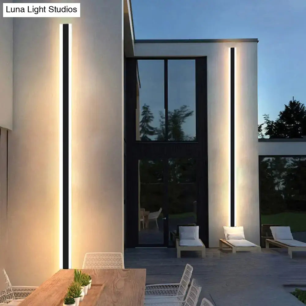 Modern black vertical led wall sconce with sleek frame and warm white light ip65 waterproof for living room use