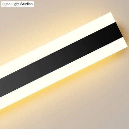 Modern black vertical led wall sconce with bold black and white stripes emitting warm glow ip65 waterproof for living room