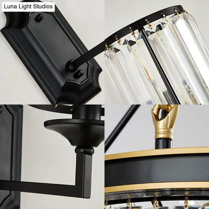 Modern black wall lamp with clear crystal prism and gold accents designed as a corridor wall lamp