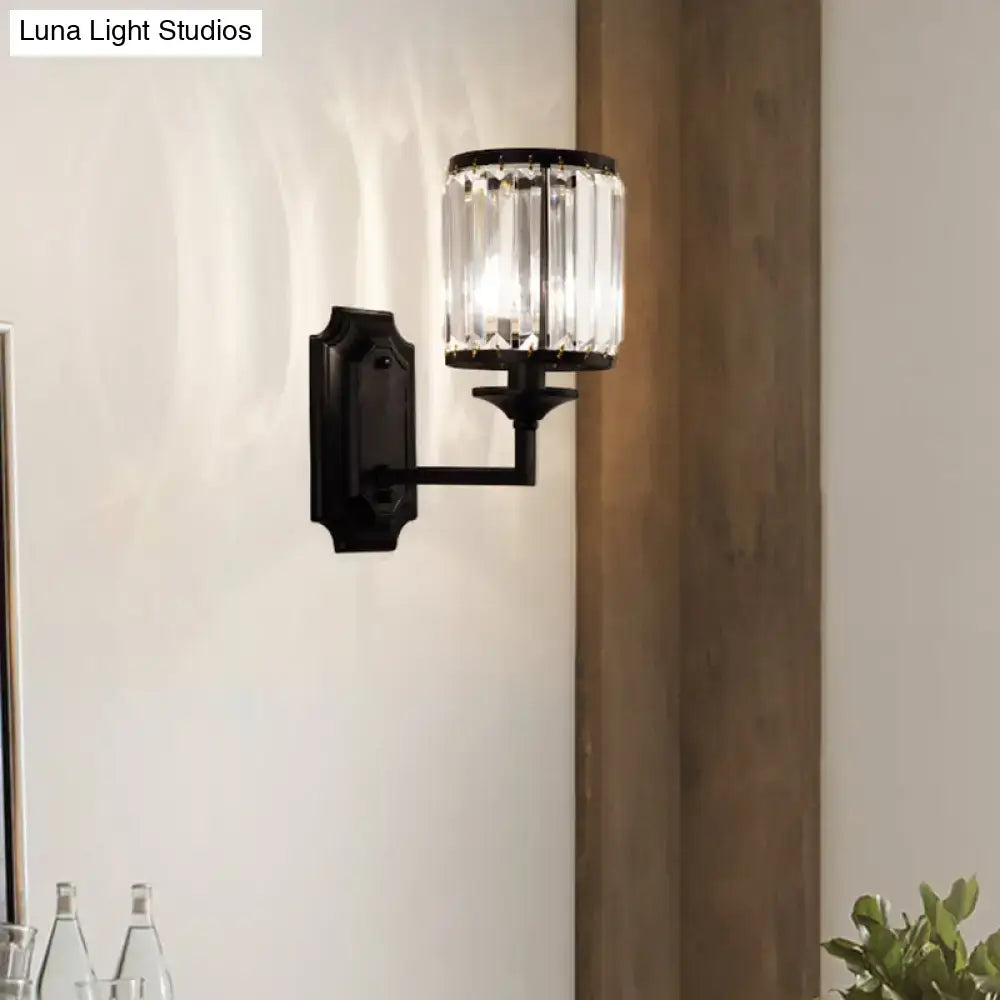 Modern black wall lamp with clear crystal prism and cylindrical glass shade for corridor lighting