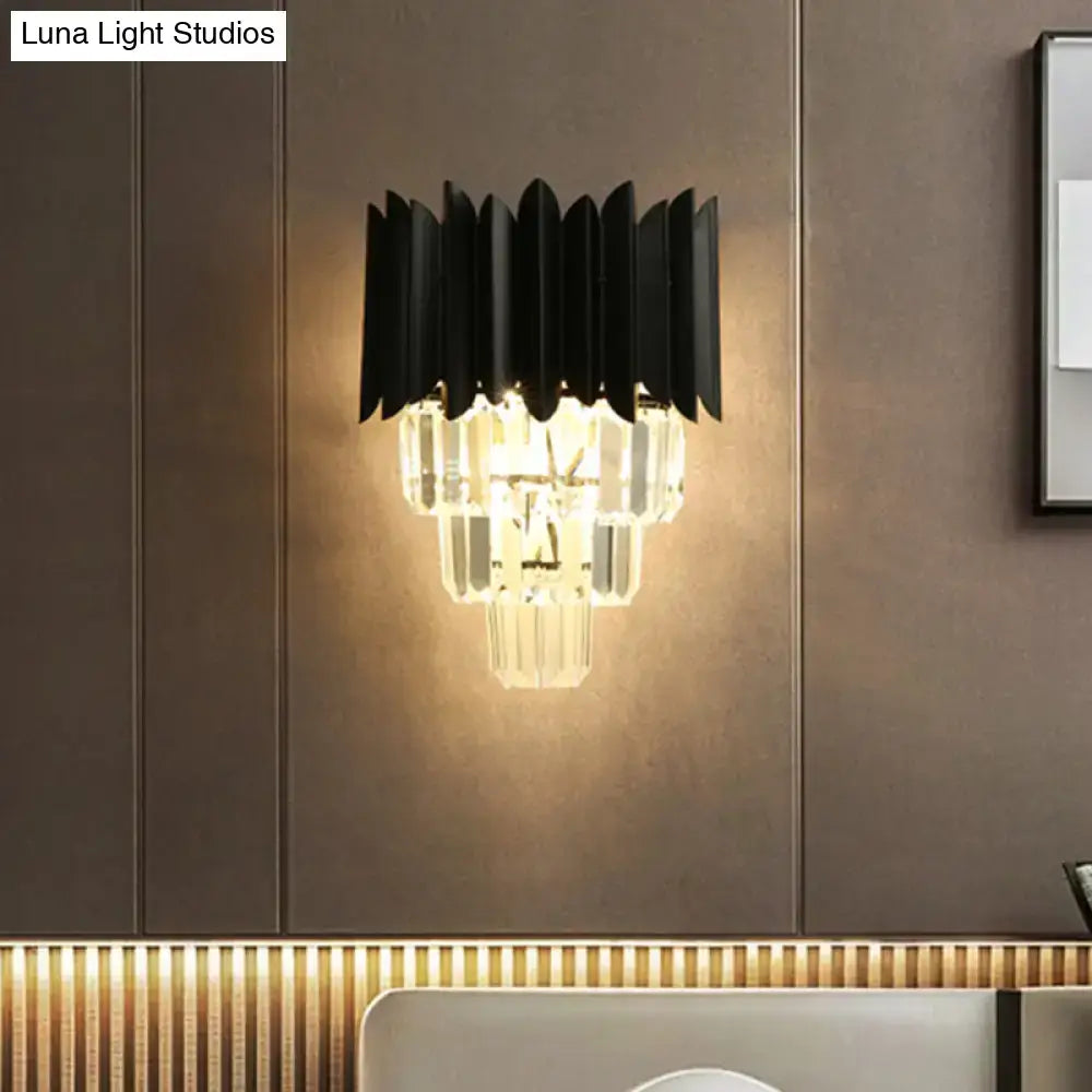 Modern black wall sconce with clear crystal prisms and layered design for wall mounted bedroom light