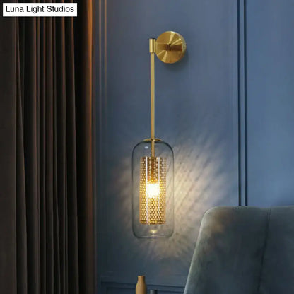 Modern black wall sconce with clear glass bell shade and intricate gold-toned wire mesh for stairway lighting