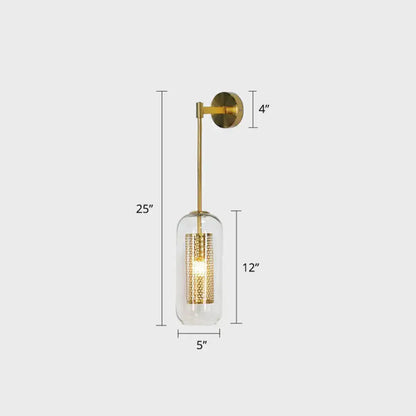 Modern black wall sconce with clear glass cylinder, gold-finished metal arm, and wire mesh LED stairway light