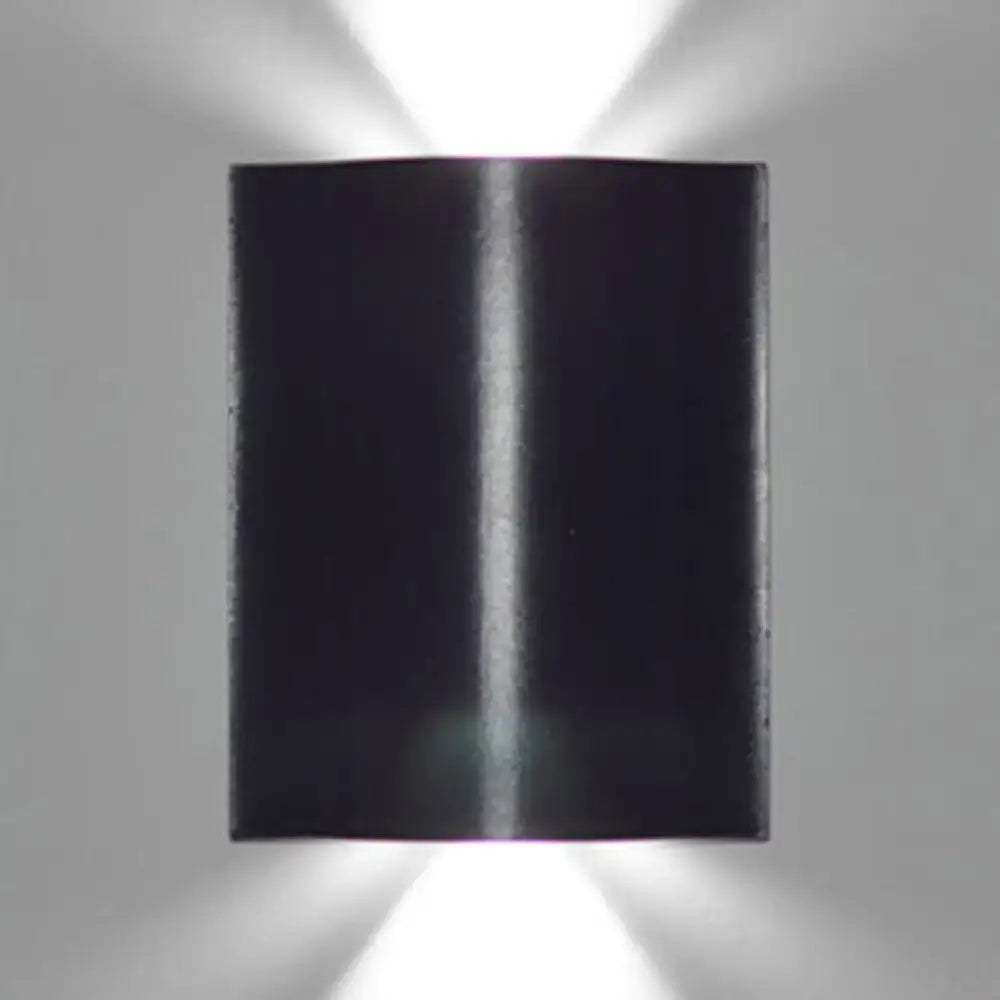 Modern black rectangular wall washer lamp with sleek design emitting warm white lighting from top and bottom beams