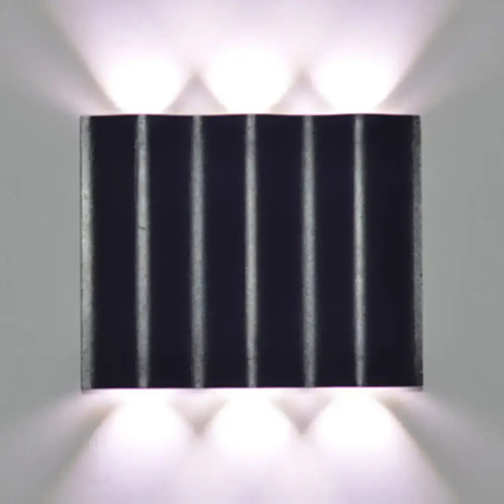 Modern black rectangular wall washer lamp with vertical ridges and matte finish for warm white lighting on porch