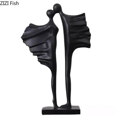 Modern black and white decorbites abstract lovers resin sculpture featuring two stylized figures embracing on a minimalist base