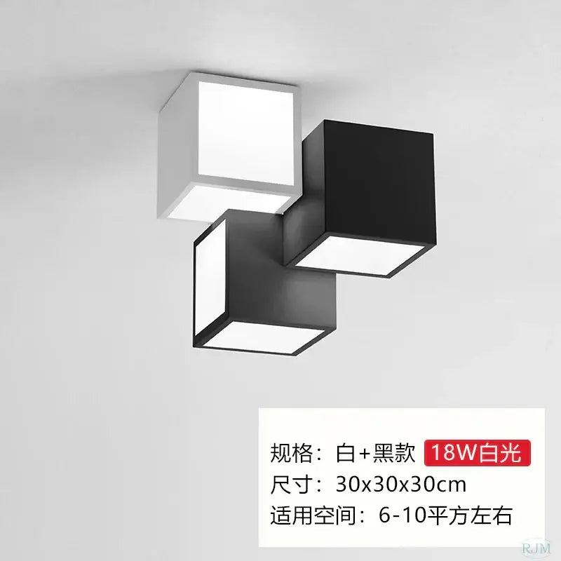 Modern black and white acrylic led ceiling light with three interlocking cube panels by decorbites