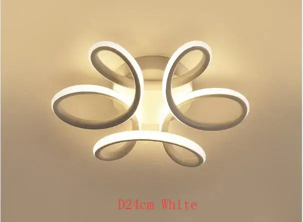 Modern black and white acrylic led ceiling light with a flower-like swirl design by decorbites for bedroom decor