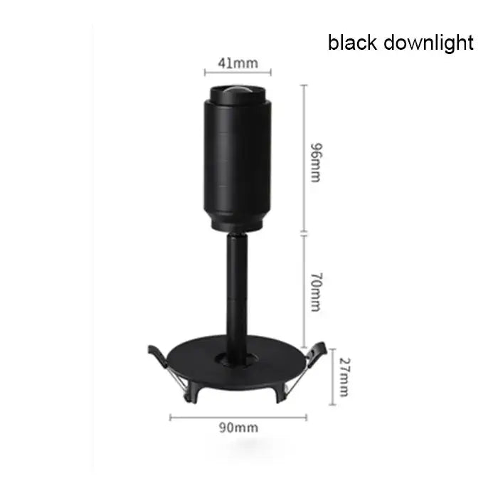 Modern black track spotlight with cylindrical head and metallic finish featuring adjustable beam angle design