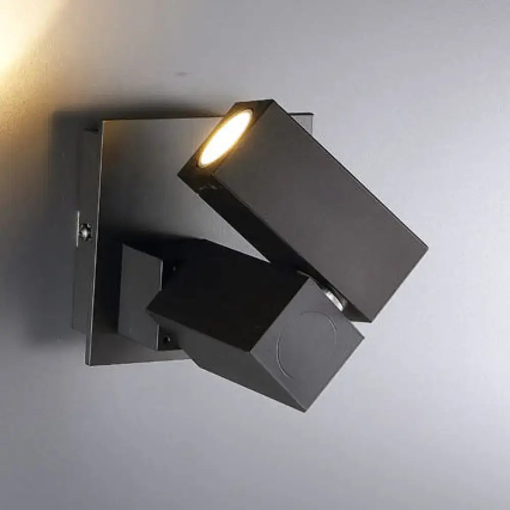 Modern black and white adjustable cube shade wall light with warm focused beam for living room lighting